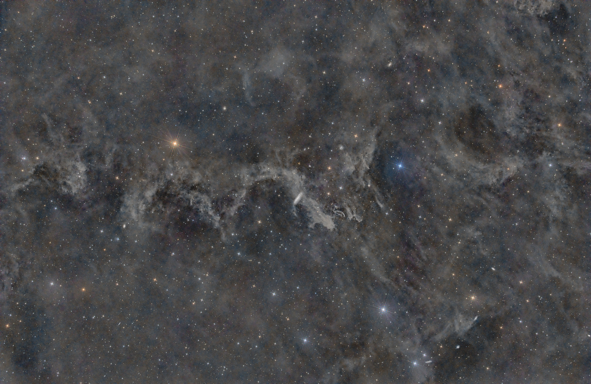 In the constellation Pegasus is the barred spiral galaxy NGC 7497 surrounded by the molecular cloud MBM 54.